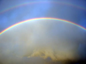 Notice how the most hostile looking weather appears to be contained by the rainbow